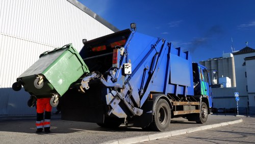Demolition site in Pimlico with waste removal equipment